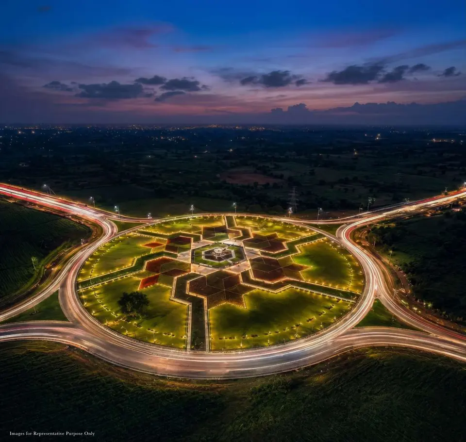 Aerial view of a Samruddhi Expressway interchange at dusk